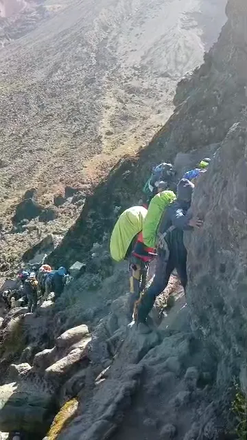Trekkers traversing the Barranco Wall