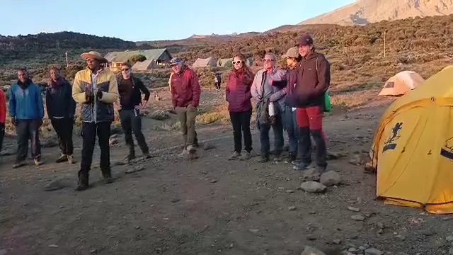 Morning briefing with the guides at camp